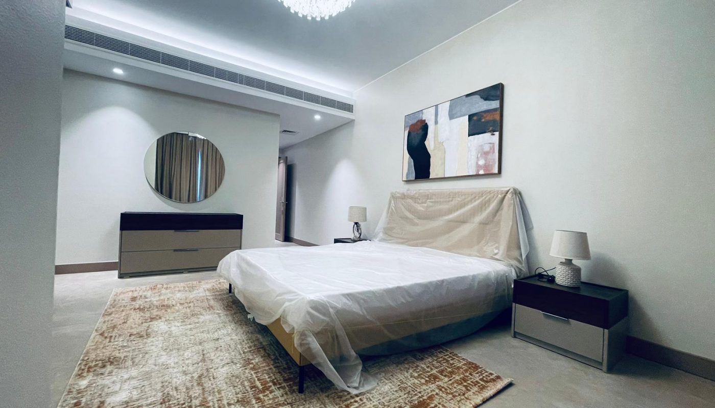 A bedroom with a draft, bed, Auto mirror.