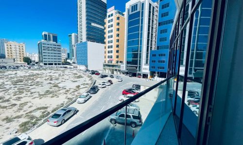 A view of parked cars in a parking lot.