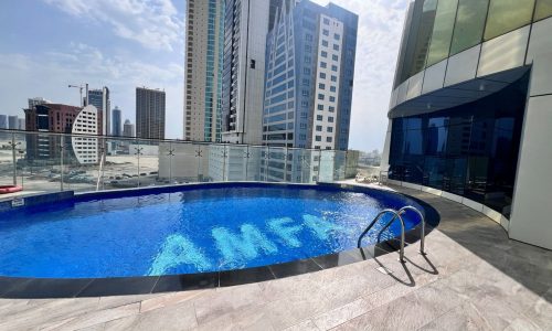 A swimming pool in the middle of a luxury apartment in Seef.