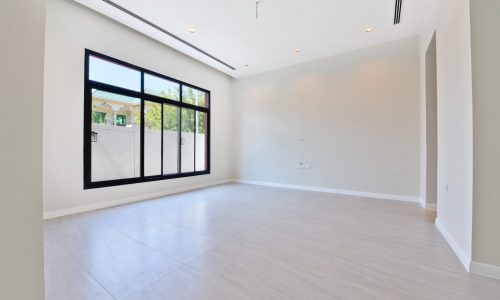 Modern empty room with large window, auto draft system, and tiled floor.