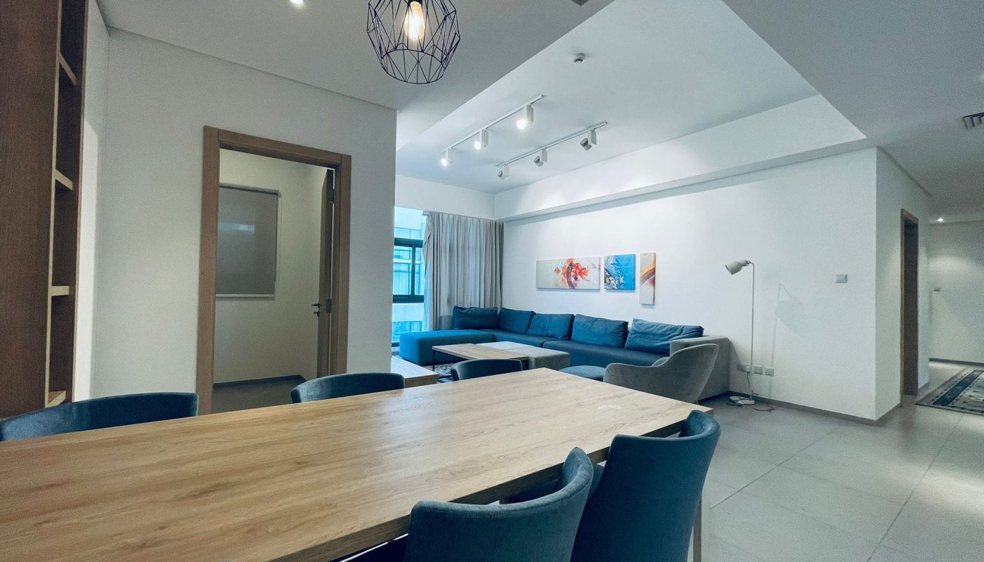 Modern open-plan living and dining room with contemporary furniture and Auto Draft lighting.