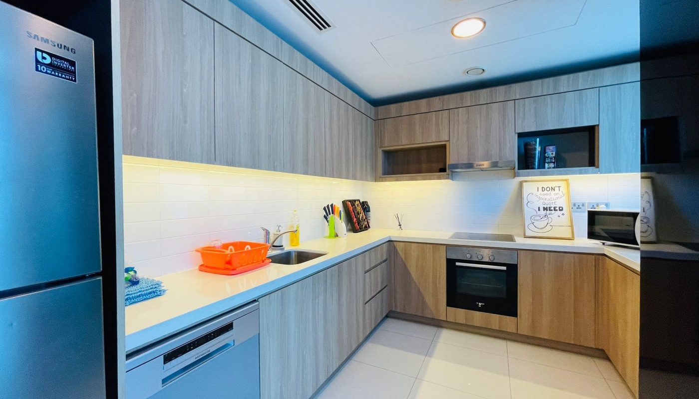 Luxury 2BR apartment in Juffair with modern kitchen interior, built-in appliances, and LED lighting available for rent.