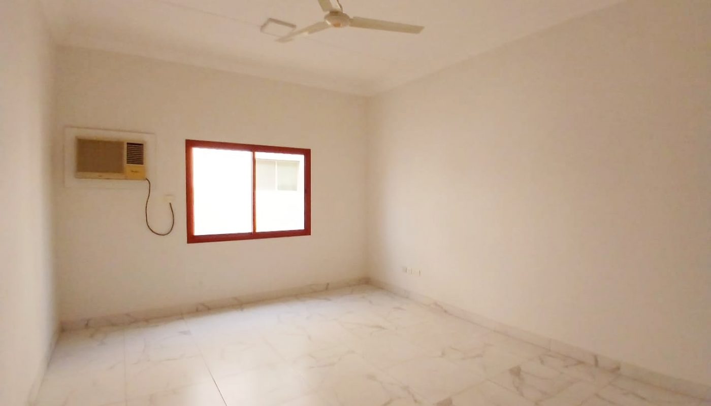 Empty room with white walls, a ceiling fan, an air conditioning unit, and an Auto Draft window with red frame.