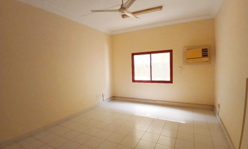 Empty room with tiled flooring, a ceiling fan, and an air conditioning unit near a window with red frames. Auto Draft