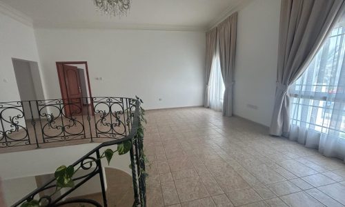 Spacious, unfurnished room with large windows, tiled flooring, and an ornate chandelier. Auto Draft