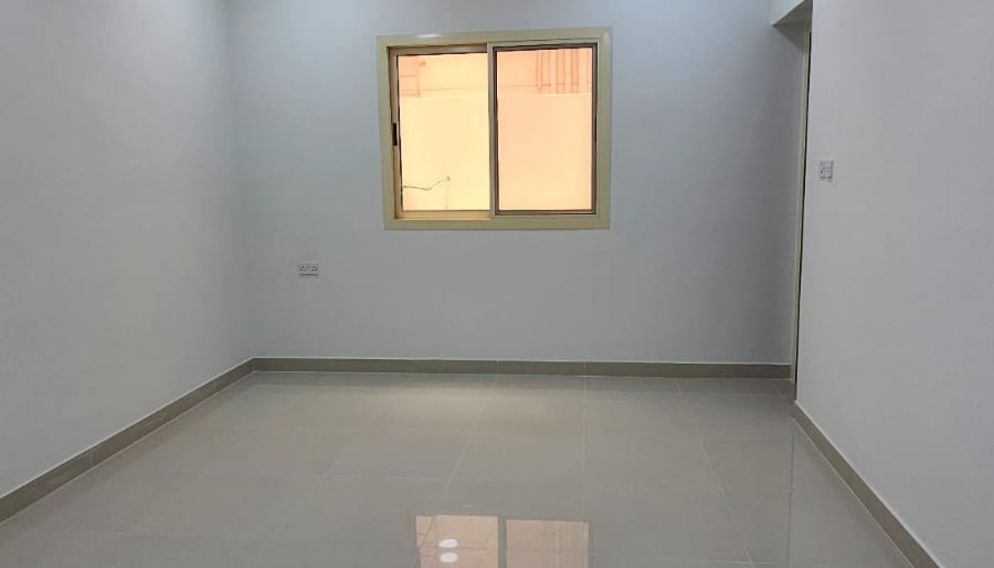 Empty, unfurnished room with tiled floor, white walls, ceiling fan, window, and recessed ceiling lights.