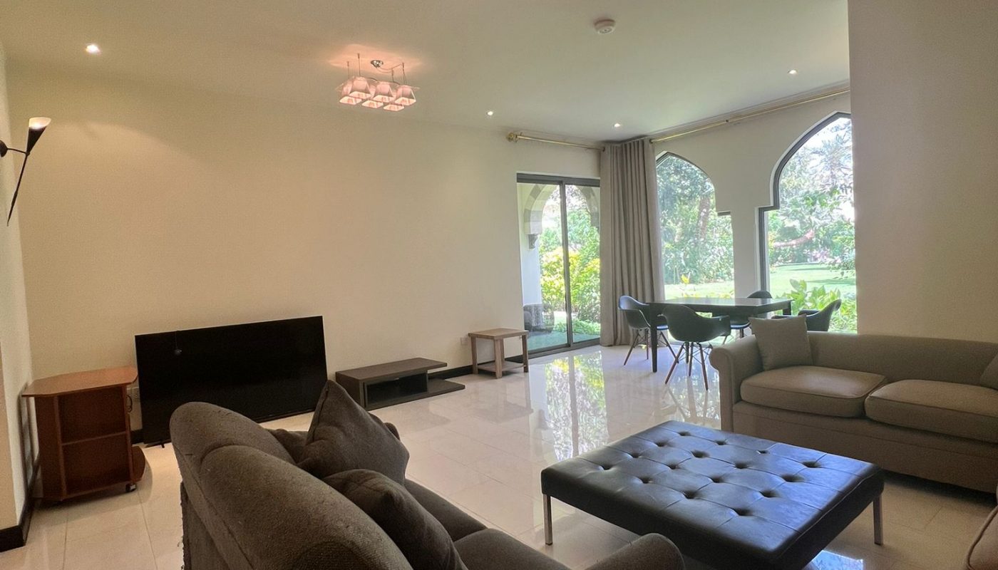 Spacious living room with modern sofas, a black ottoman, dining table, large windows, glossy tiled floor, and contemporary ceiling lights.