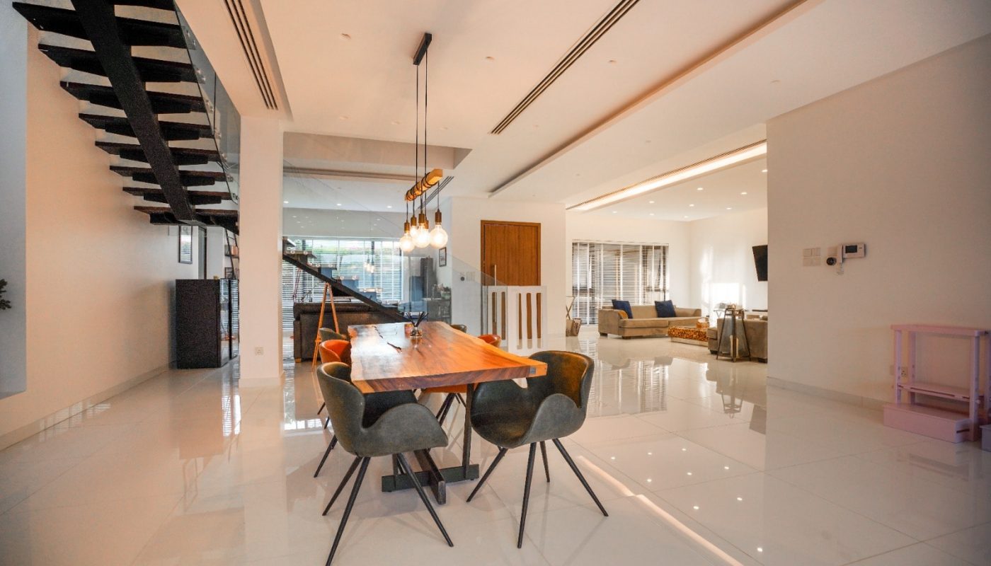 An eye-catching home with a modern dining table and chairs for sale in Al Qurrayah, featuring 2 roads access.