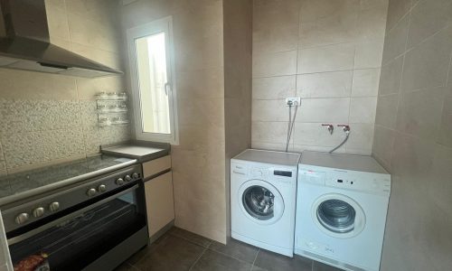 Modern 3BR Apartments for Sale in Hidd with small kitchen.