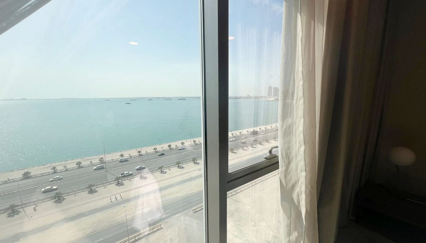 A luxurious view of the ocean from a flat in a hotel room.