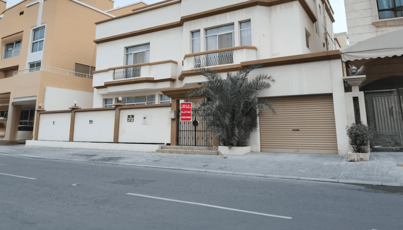 A furnished house for rent in the middle of a street.