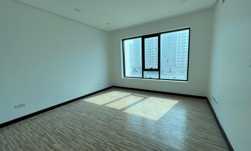 A luxury apartment with hardwood floors and a view of the city.