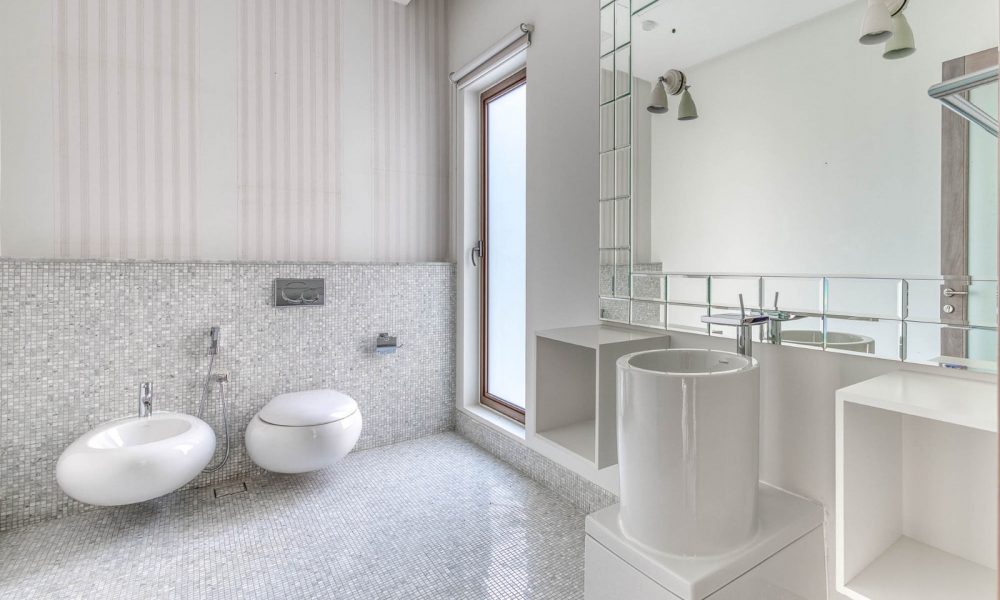 A stunning bathroom with a sink and toilet.