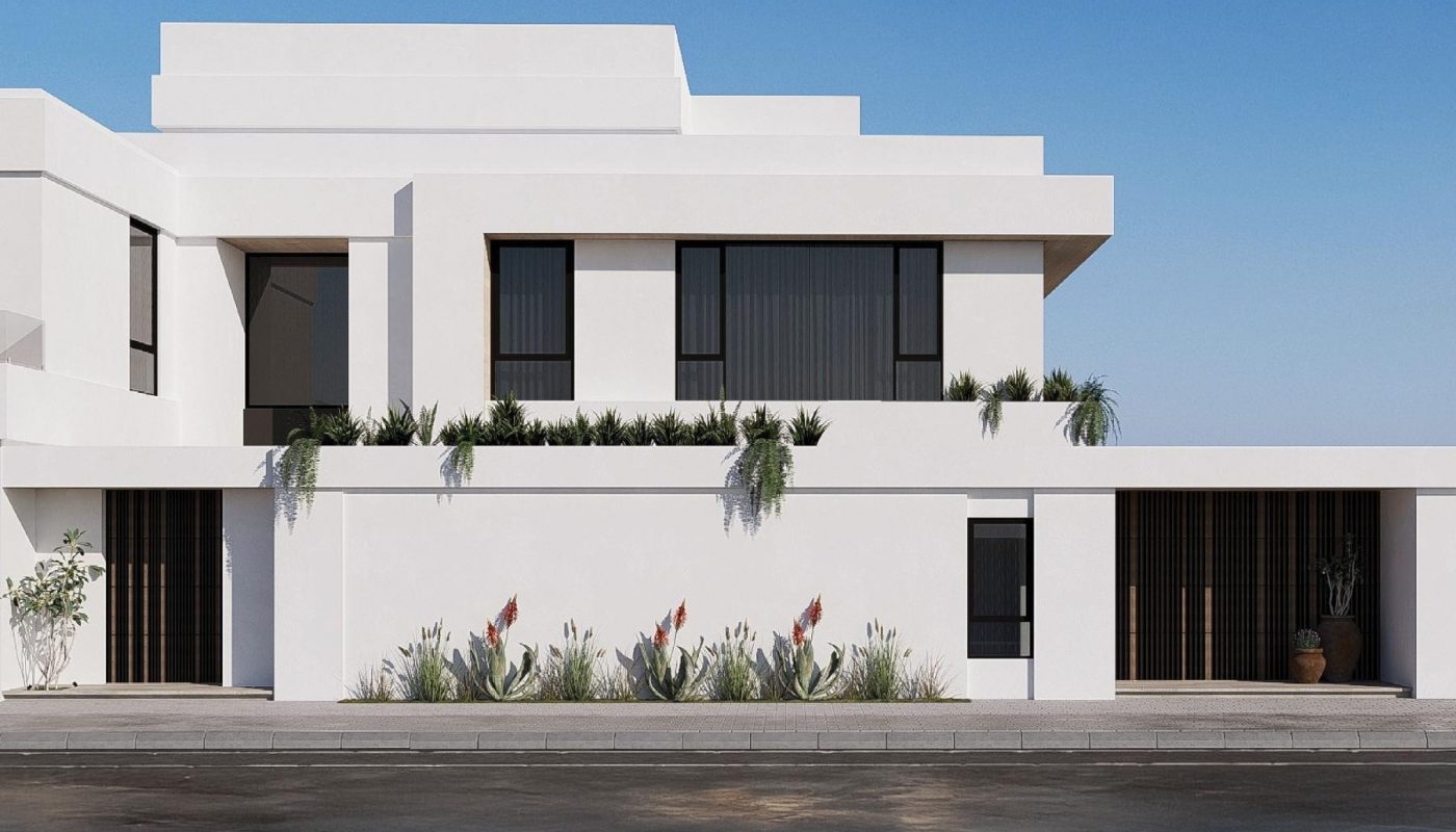 Modern white two-story building with large windows, flat rooflines, and minimal landscaping against a clear blue sky.