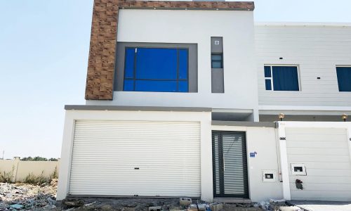 Perfect Location 4BR Villa for Sale in Malkiyah with a garage door.