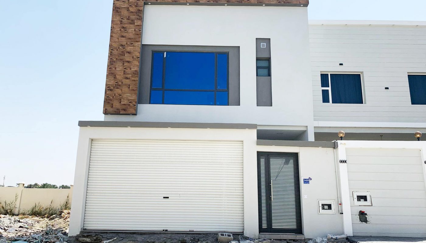 Perfect Location 4BR Villa for Sale in Malkiyah with a garage door.