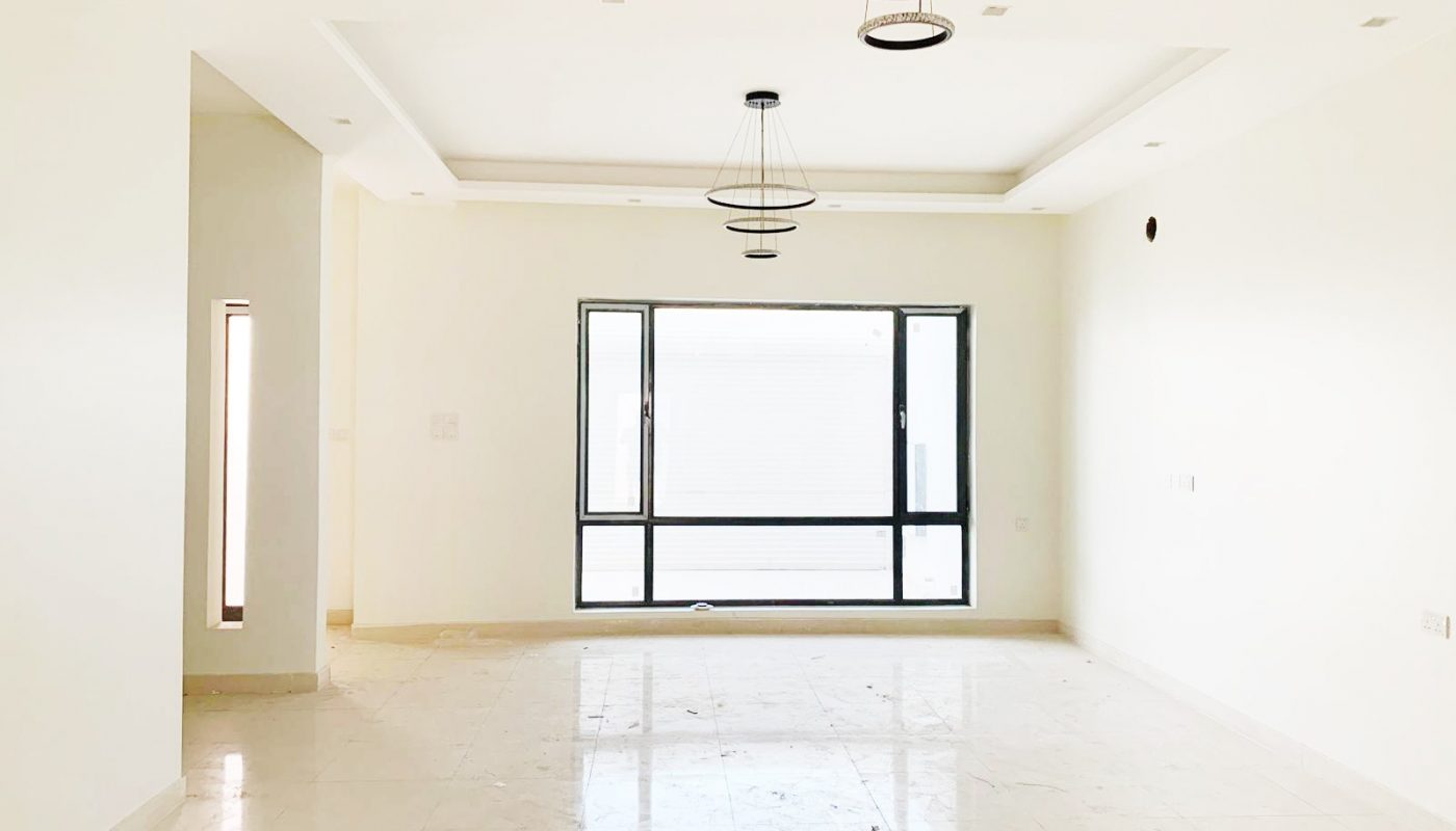 Perfect Location 4BR Villa with an empty room, white floor, and a light fixture.