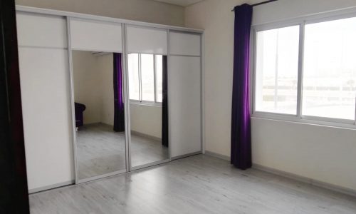 Luxury Villa for Sale: A lavishly appointed room with purple curtains and a spacious closet.