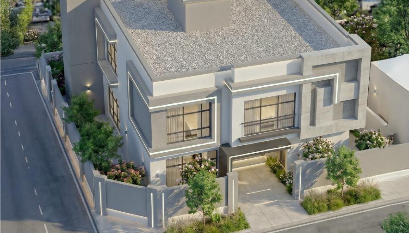 A modern two-story house with a flat roof, large windows, and landscaped yards, situated on a corner lot in an urban neighborhood with a city skyline in the background.